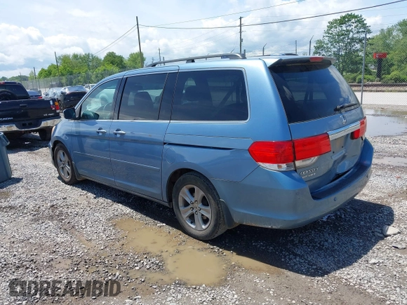 2010 Honda Odyssey Touring with VIN 5FNRL3H93AB058240, listed as a IAAI auction lot 42211192 with 223,859 mi miles and . Bid and sale history available at DreamBid. Image 3.
