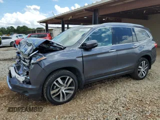 2018 Honda Pilot Touring with VIN 5FNYF6H97JB037119, listed as a Copart auction lot 61089225 with 65,275 mi miles and Salvage title. Bid and sale history available at DreamBid. Image 1.