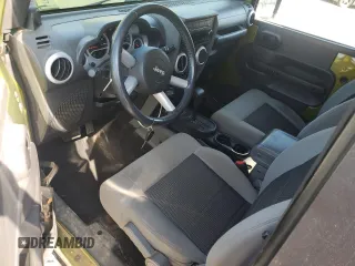 2010 Jeep Wrangler Sahara with VIN 1J4AA5D16AL203910, listed as a Copart auction lot 62891315 with 124,337 mi miles and Salvage title. Bid and sale history available at DreamBid. Image 8.
