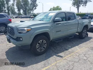 2022 Toyota Tacoma SR5 with VIN 3TMBZ5DN1NM035572, listed as a IAAI auction lot 42083925 with 82,596 mi miles and . Bid and sale history available at DreamBid. Image 2.