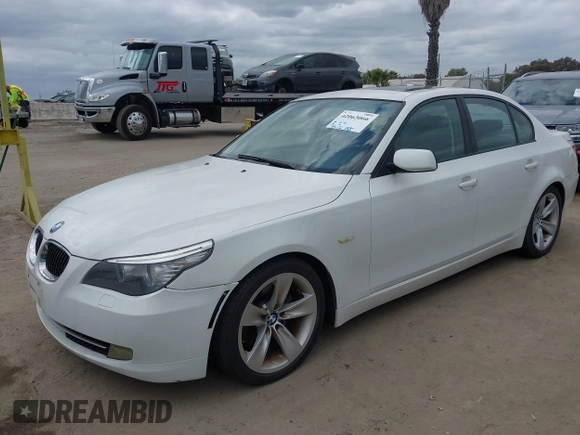 2009 BMW 5 Series 528i with VIN WBANU53529C121927, listed as a IAAI auction lot 42063066 with 195,322 mi miles and . Bid and sale history available at carsss.com. Image 2.