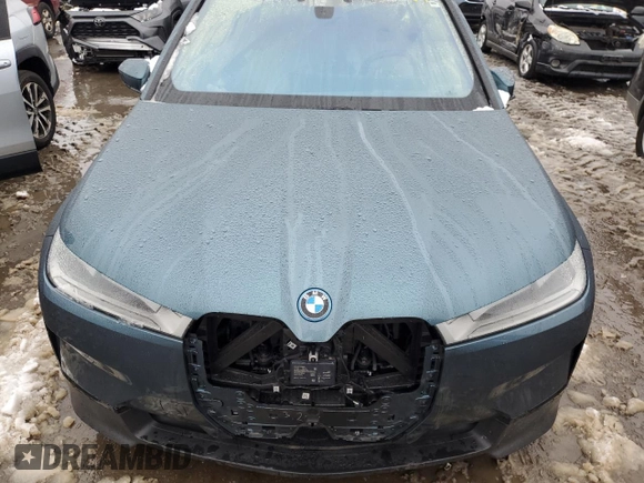 2023 BMW iX xDrive50 with VIN WB523CF02PCM42677, listed as a Copart auction lot 83855194 with 17,025 mi miles and Salvage Title. Bid and sale history available at carsss.com. Image 12.