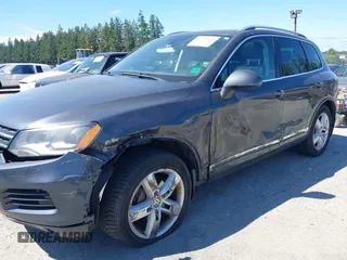 2012 Volkswagen Touareg Sport with VIN WVGFK9BP0CD004951, listed as a IAAI auction lot 42724125 with 173,993 mi miles and . Bid and sale history available at DreamBid. Image 6.