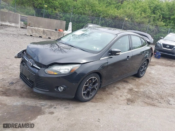 2012 Ford Focus Titanium with VIN 1FAHP3J2XCL369554, listed as a IAAI auction lot 42072931 with 95,474 mi miles. Bid and sale history available at carsss.com. Image 2.
