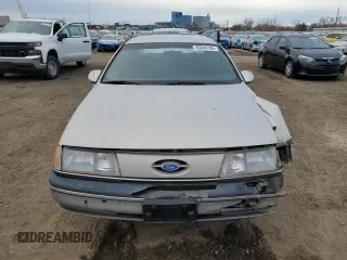 1991 Ford Taurus with VIN 1FACP52U9MG101093, listed as a Copart auction lot 45948105 with 594,696 mi miles and Salvage title. Bid and sale history available at DreamBid. Image 5.