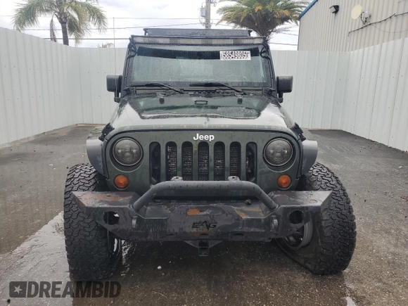 2012 Jeep Wrangler Unlimited Sport with VIN 1C4HJWDG8CL122067, listed as a Copart auction lot 58549805 with 124,658 mi miles and Clean title. Bid and sale history available at DreamBid. Image 5.