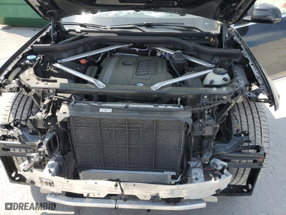 2022 BMW X7 xDrive40i with VIN 5UXCW2C05N9N00658, listed as a Copart auction lot 52007945 with 23,690 mi miles and Salvage Title. Bid and sale history available at carsss.com. Image 12.