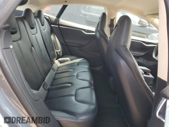2013 Tesla Model S with VIN 5YJSA1AG9DFP04910, listed as a Copart auction lot 60827335 with 97,022 mi miles and Salvage title. Bid and sale history available at DreamBid. Image 10.
