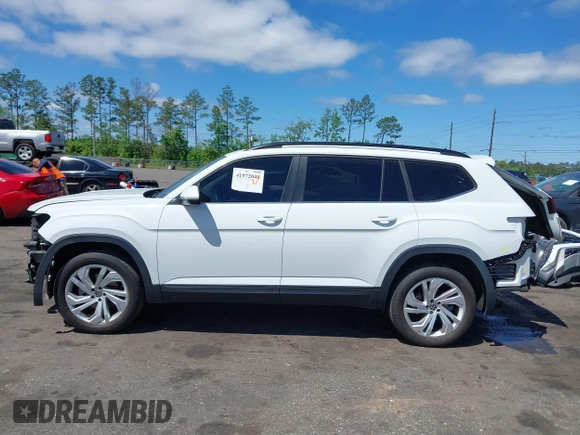 2021 Volkswagen Atlas SE z VIN 1V2WR2CA2MC529355, wystawiony jako IAAI lot #41972048 z przebiegiem 63 970 mil mil oraz . Historia ofert i sprzedaży dostępna na DreamBid. Obrazek 14.
