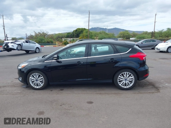 2017 Ford Focus Titanium z VIN 1FADP3N24HL326330, wystawiony jako IAAI lot #42594927 z przebiegiem 54 727 mil mil oraz . Historia ofert i sprzedaży dostępna na DreamBid. Obrazek 14.