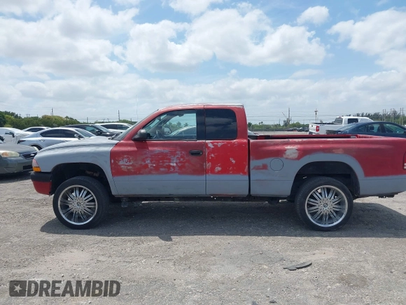2002 Dodge Dakota Sport with VIN 1B7GL32X82S632091, listed as a IAAI auction lot 42091290 with 206,721 mi miles and . Bid and sale history available at carsss.com. Image 15.