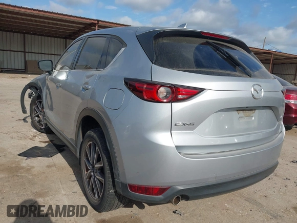 2018 Mazda CX-5 Grand Touring with VIN JM3KFADM6J0325626, listed as a IAAI auction lot 42054702 with 121,952 mi miles and . Bid and sale history available at DreamBid. Image 3.