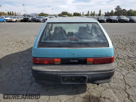 1992 Geo Metro z VIN 2C1MS2465N6782913, wystawiony jako Copart lot #77405574 z przebiegiem 77 080 mil mil oraz Szkody całkowita. Historia ofert i sprzedaży dostępna na DreamBid. Obrazek 6.