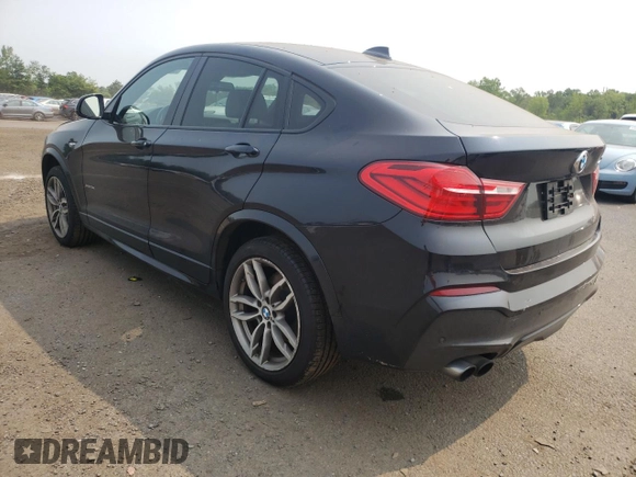 2015 BMW X4 xDrive35i with VIN 5UXXW5C59F0E87517, listed as a Copart auction lot 59604445 with 185,064 mi miles and Salvage title. Bid and sale history available at DreamBid. Image 2.