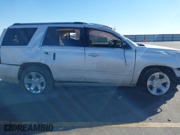 2016 Chevrolet Tahoe LTZ z VIN 1GNSKCKC0GR214110, wystawiony jako IAAI lot #41680822 z przebiegiem 60 271 mil mil oraz . Historia ofert i sprzedaży dostępna na DreamBid. Obrazek 14.