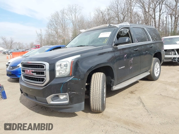 2015 GMC Yukon SLT z VIN 1GKS1BKCXFR192349, wystawiony jako IAAI lot #41842474 z przebiegiem 185 166 mil mil oraz . Historia ofert i sprzedaży dostępna na DreamBid. Obrazek 2.