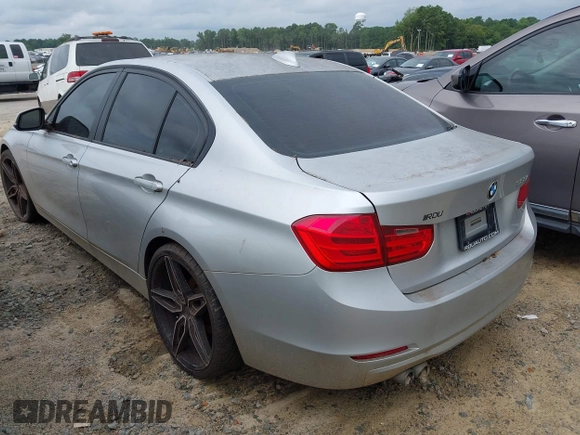 2014 BMW 3 Series 328i with VIN WBA3A5G52ENP31318, listed as a IAAI auction lot 42801411 with 149,355 mi miles and . Bid and sale history available at DreamBid. Image 3.