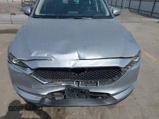 2019 Mazda CX-5 Sport with VIN JM3KFBBM6K1582760, listed as a IAAI auction lot 41822152 with 60,620 mi miles and . Bid and sale history available at DreamBid. Image 6.