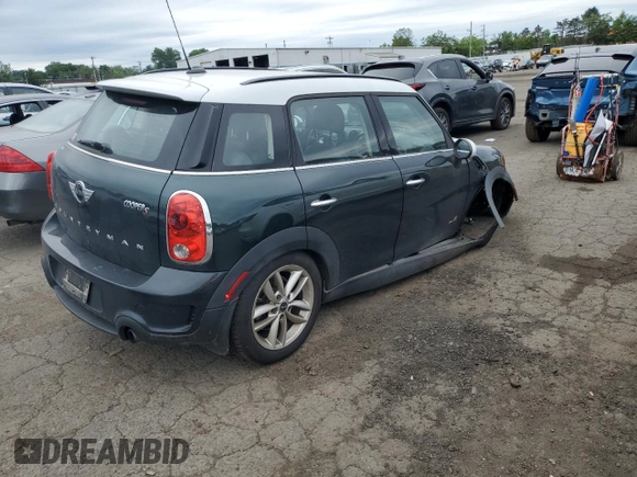 2014 MINI Countryman S with VIN WMWZC5C58EWP39797, listed as a Copart auction lot 62193515 with 84,989 mi miles and Salvage title. Bid and sale history available at DreamBid. Image 3.