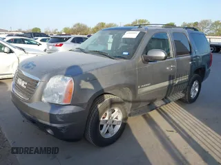 2008 GMC Yukon SLT w/4SB with VIN 1GKFK13078R227526, listed as a IAAI auction lot 41830004 with 143,728 mi miles. Bid and sale history available at carsss.com. Image 2.