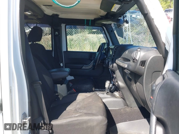 2015 Jeep Wrangler Unlimited Willys Wheeler with VIN 1C4BJWDG0FL546000, listed as a IAAI auction lot 41984566 with 112,742 mi miles and . Bid and sale history available at DreamBid. Image 5.