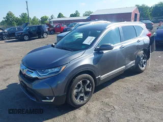2018 Honda CR-V Touring z VIN 5J6RW2H93JL004834, wystawiony jako IAAI lot #42351364 z przebiegiem 63 746 mil mil oraz . Historia ofert i sprzedaży dostępna na DreamBid. Obrazek 17.