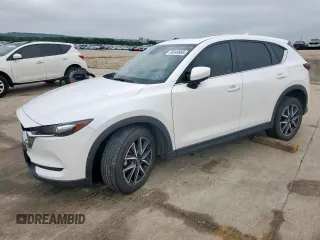 2018 Mazda CX-5 Touring z VIN JM3KFACM0J0469433, wystawiony jako Copart lot #54349955 z przebiegiem Nie podano mil oraz Szkoda całkowita • Salvage title. Historia ofert i sprzedaży dostępna na DreamBid. Obrazek 1.