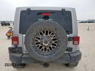 2014 Jeep Wrangler Unlimited Rubicon с VIN 1C4HJWFG3EL322449, выставлен на аукционе Copart как лот 57187665 с пробегом 122 469 миль миль и Списание • Salvage title. История ставок и продаж доступна на DreamBid. Изображение 6.
