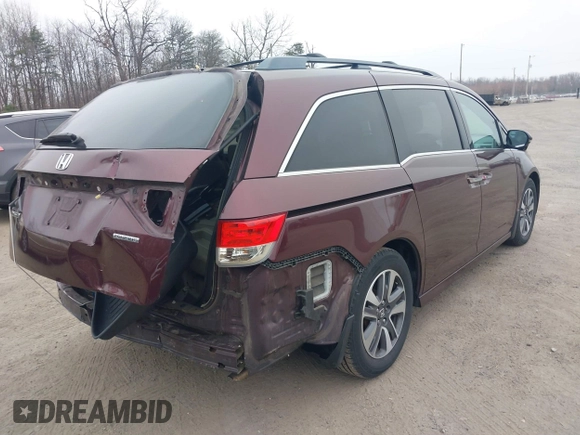 2014 Honda Odyssey Touring with VIN 5FNRL5H97EB117971, listed as a IAAI auction lot 41794324 with 198,191 mi miles and . Bid and sale history available at DreamBid. Image 4.