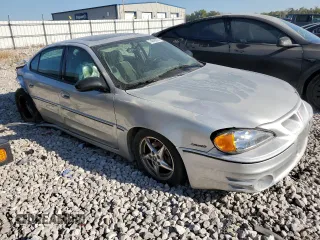 2004 Pontiac Grand Am GT with VIN 1G2NW52E64C130013, listed as a Copart auction lot 74018514 with 165,657 mi miles and Salvage Title. Bid and sale history available at carsss.com. Image 4.