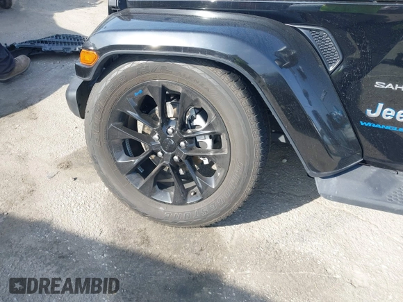 2023 Jeep Wrangler Sahara with VIN 1C4JJXP67PW556933, listed as a IAAI auction lot 41587035 with 20,463 mi miles and . Bid and sale history available at DreamBid. Image 18.