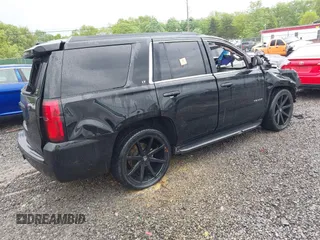 2018 Chevrolet Tahoe LT with VIN 1GNSCBKC2JR359681, listed as a IAAI auction lot 42287525 with 144,568 mi miles and . Bid and sale history available at DreamBid. Image 4.
