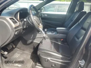 2014 Jeep Grand Cherokee Summit with VIN 1C4RJFJT4EC346946, listed as a Copart auction lot 60613025 with 50,565 mi miles and Salvage title. Bid and sale history available at DreamBid. Image 7.