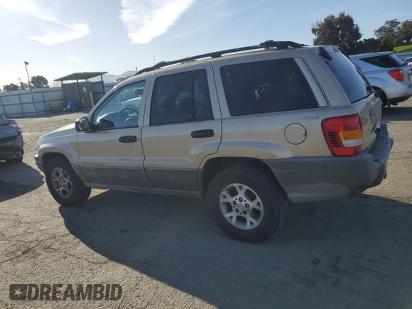 1999 Jeep Grand Cherokee Laredo z VIN 1J4GW58NXXC704719, wystawiony jako Copart lot #49546395 z przebiegiem 276 716 mil mil oraz Czysty tytuł • Clean title. Historia ofert i sprzedaży dostępna na DreamBid. Obrazek 2.