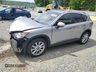 2014 Mazda CX-5 Grand Touring with VIN JM3KE4DY9E0416967, listed as a Copart auction lot 54215285 with 77,296 mi miles and Salvage Title. Bid and sale history available at DreamBid. Image 1.