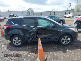 2013 Ford Escape SE with VIN 1FMCU0GX1DUA99040, listed as a IAAI auction lot 42084787 with 140,473 mi miles and . Bid and sale history available at DreamBid. Image 13.