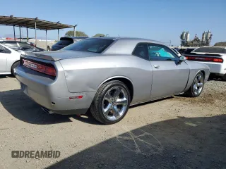 2014 Dodge Challenger R/T z VIN 2C3CDYBT2EH101684, wystawiony jako Copart lot #53581785 z przebiegiem 159 637 mil mil oraz Szkoda całkowita • Salvage title. Historia ofert i sprzedaży dostępna na DreamBid. Obrazek 3.