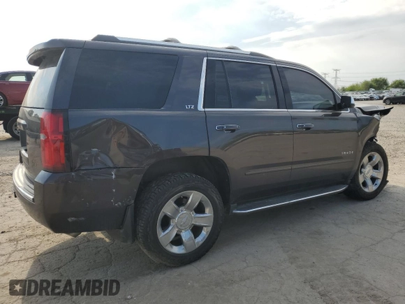 2015 Chevrolet Tahoe LTZ z VIN 1GNSKCKC4FR626030, wystawiony jako Copart lot #56280805 z przebiegiem Nie podano mil oraz Szkoda całkowita • Salvage title. Historia ofert i sprzedaży dostępna na DreamBid. Obrazek 3.