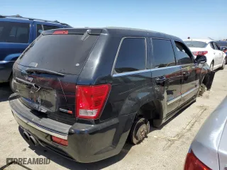 2007 Jeep Grand Cherokee SRT-8 with VIN 1J8HR78387C603473, listed as a Copart auction lot 57712964 with 114,429 mi miles and Salvage Title. Bid and sale history available at carsss.com. Image 3.