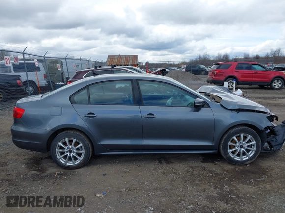 2014 Volkswagen Jetta SE z VIN 3VWD17AJ9EM358777, wystawiony jako IAAI lot #41880077 z przebiegiem 161 985 mil mil oraz . Historia ofert i sprzedaży dostępna na DreamBid. Obrazek 14.
