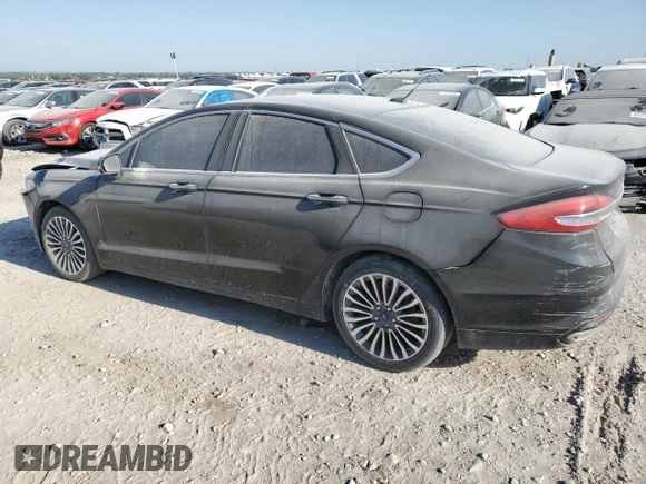 2017 Ford Fusion SE z VIN 3FA6P0H98HR179253, wystawiony jako Copart lot #52015345 z przebiegiem 99 883 mil mil oraz Czysty tytuł • Clean title. Historia ofert i sprzedaży dostępna na DreamBid. Obrazek 2.