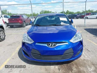 2012 Hyundai Veloster w/Gray Int z VIN KMHTC6AD3CU074501, wystawiony jako IAAI lot #42289456 z przebiegiem 94 303 mil mil oraz . Historia ofert i sprzedaży dostępna na DreamBid. Obrazek 6.
