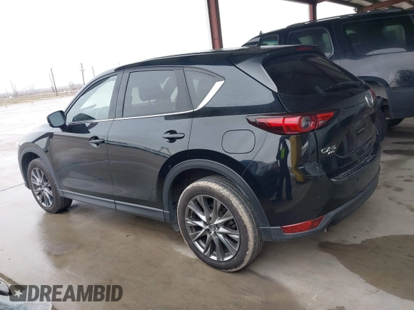 2021 Mazda CX-5 Signature with VIN JM3KFBEY5M0432033, listed as a IAAI auction lot 41607215 with 49,870 mi miles. Bid and sale history available at carsss.com. Image 14.