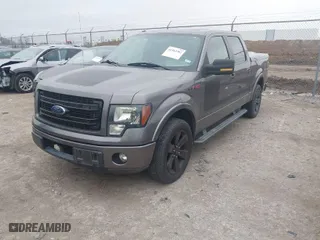 2013 Ford F-150 XL with VIN 1FTFW1CT7DFB60657, listed as a IAAI auction lot 41562282 with 121,633 mi miles. Bid and sale history available at carsss.com. Image 2.