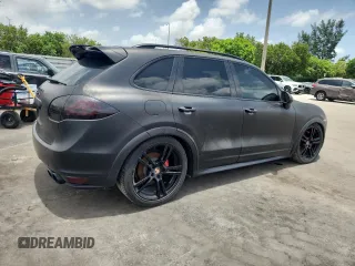 2014 Porsche Cayenne GTS z VIN WP1AD2A28ELA74131, wystawiony jako Copart lot #60239115 z przebiegiem Nie podano mil oraz Czysty tytuł • Clean title. Historia ofert i sprzedaży dostępna na DreamBid. Obrazek 3.