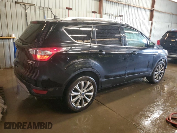 2018 Ford Escape Titanium with VIN 1FMCU9J9XJUA01357, listed as a Copart auction lot 56868735 with 67,315 mi miles and Salvage title. Bid and sale history available at DreamBid. Image 3.