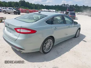 2013 Ford Fusion SE Hybrid z VIN 3FA6P0LU8DR265460, wystawiony jako IAAI lot #42720385 z przebiegiem 146 179 mil mil oraz . Historia ofert i sprzedaży dostępna na DreamBid. Obrazek 4.