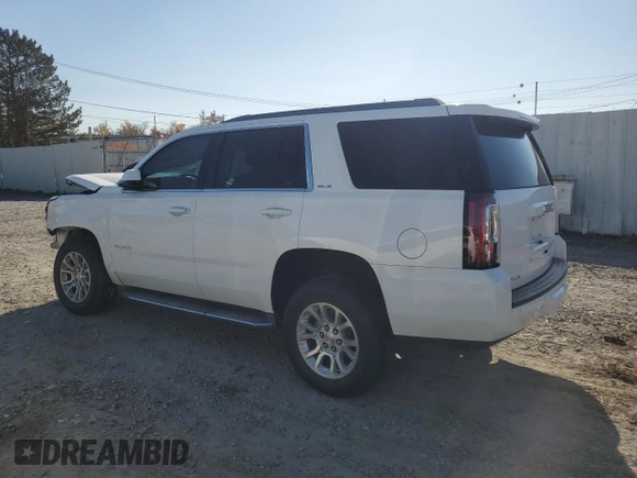2015 GMC Yukon SLE with VIN 1GKS2AKCXFR107517, listed as a Copart auction lot 76950354 with Not Provided miles and Salvage Title. Bid and sale history available at DreamBid. Image 2.