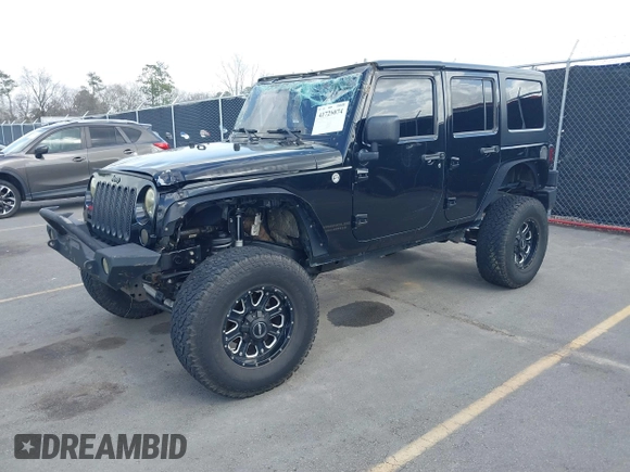 2014 Jeep Wrangler Unlimited Rubicon with VIN 1C4BJWFG0EL116026, listed as a IAAI auction lot 41729074 with 154,597 mi miles. Bid and sale history available at carsss.com. Image 2.