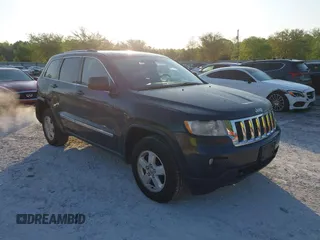 2012 Jeep Grand Cherokee Laredo with VIN 1C4RJFAG5CC234382, listed as a IAAI auction lot 42010153 with 185,078 mi miles. Bid and sale history available at carsss.com. Image 1.